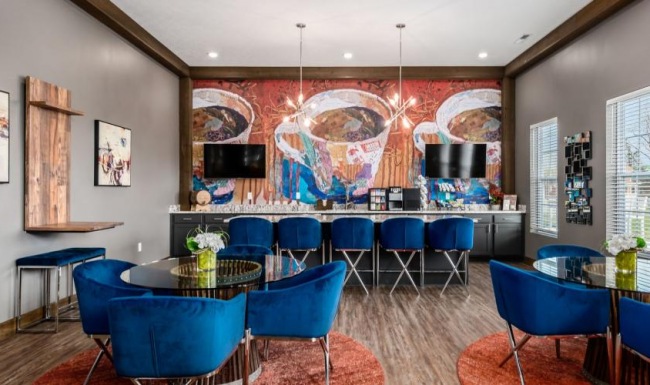 a room with blue chairs and tables